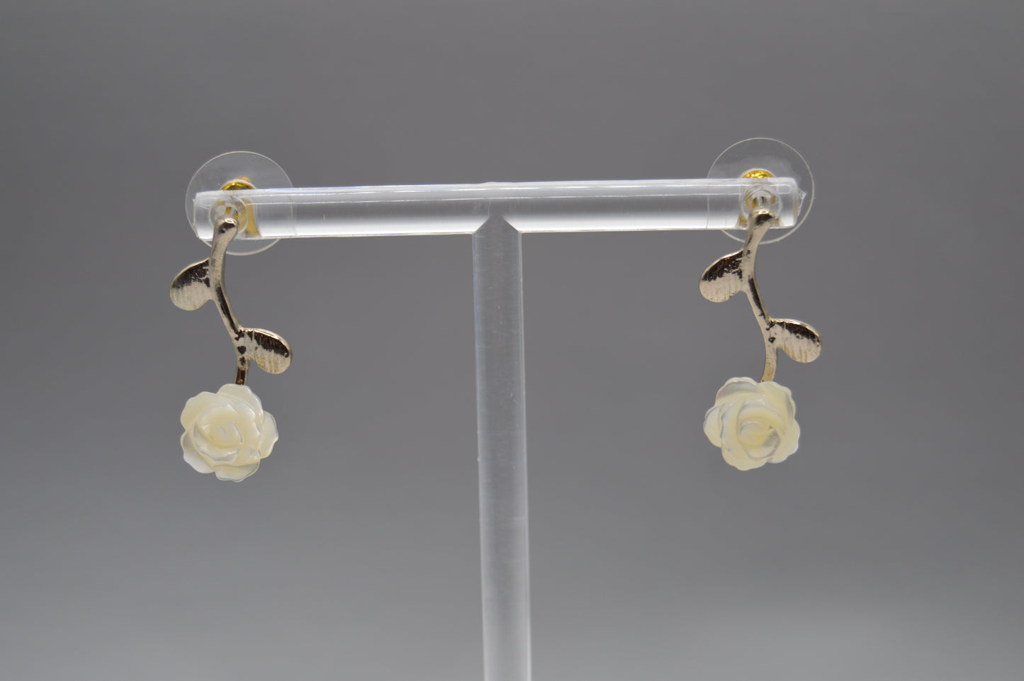 White Rose Drop Earrings ā Leaf Stem Design